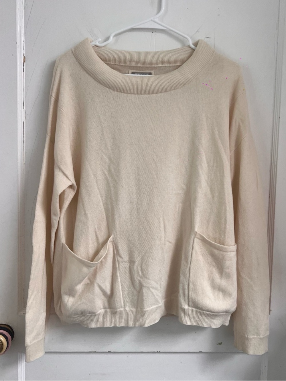 Hemisphere cashmere cream-colored
knit pullover with pockets $450
Size 36
